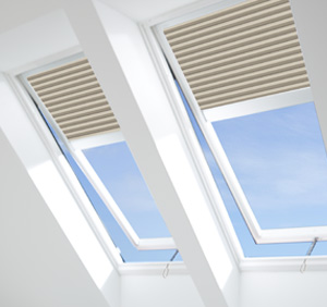 two Velux venting skylights with solar powered shaded installed by Skylights of Rhode Island
reachable at 401-268-7510